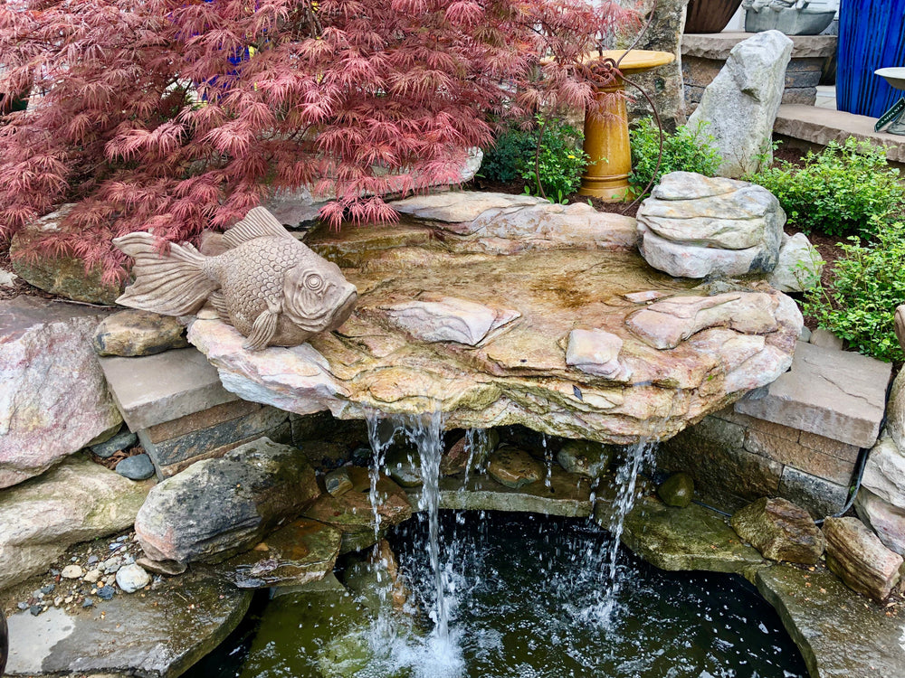 Inviting Garden Oasis: Adding a Pond Waterfall Feature